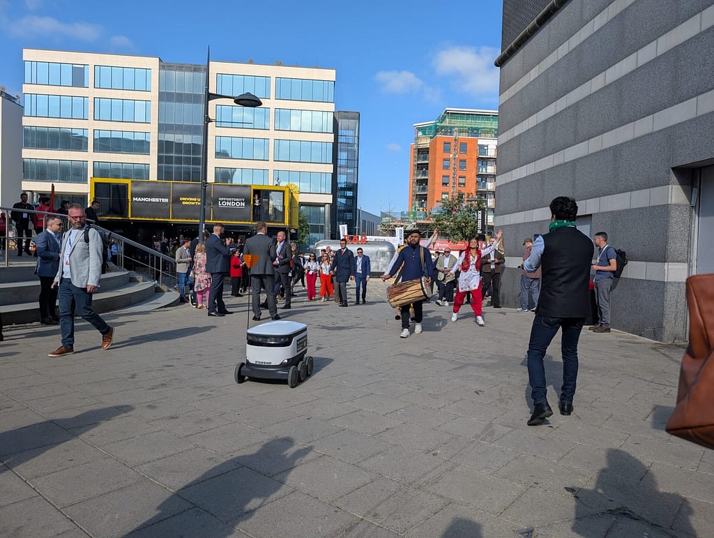 A robot and dancers at UKREiiF